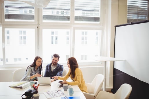 Photo editors using laptop in meeting room at office-1