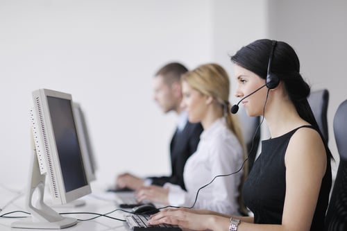 business people group with headphones giving support in help desk office to customers, manager giving training and education instructions