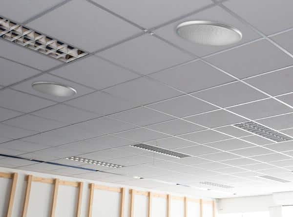 Ceiling array microphones installed in suspended ceiling tiles for permanent overhead coverage.